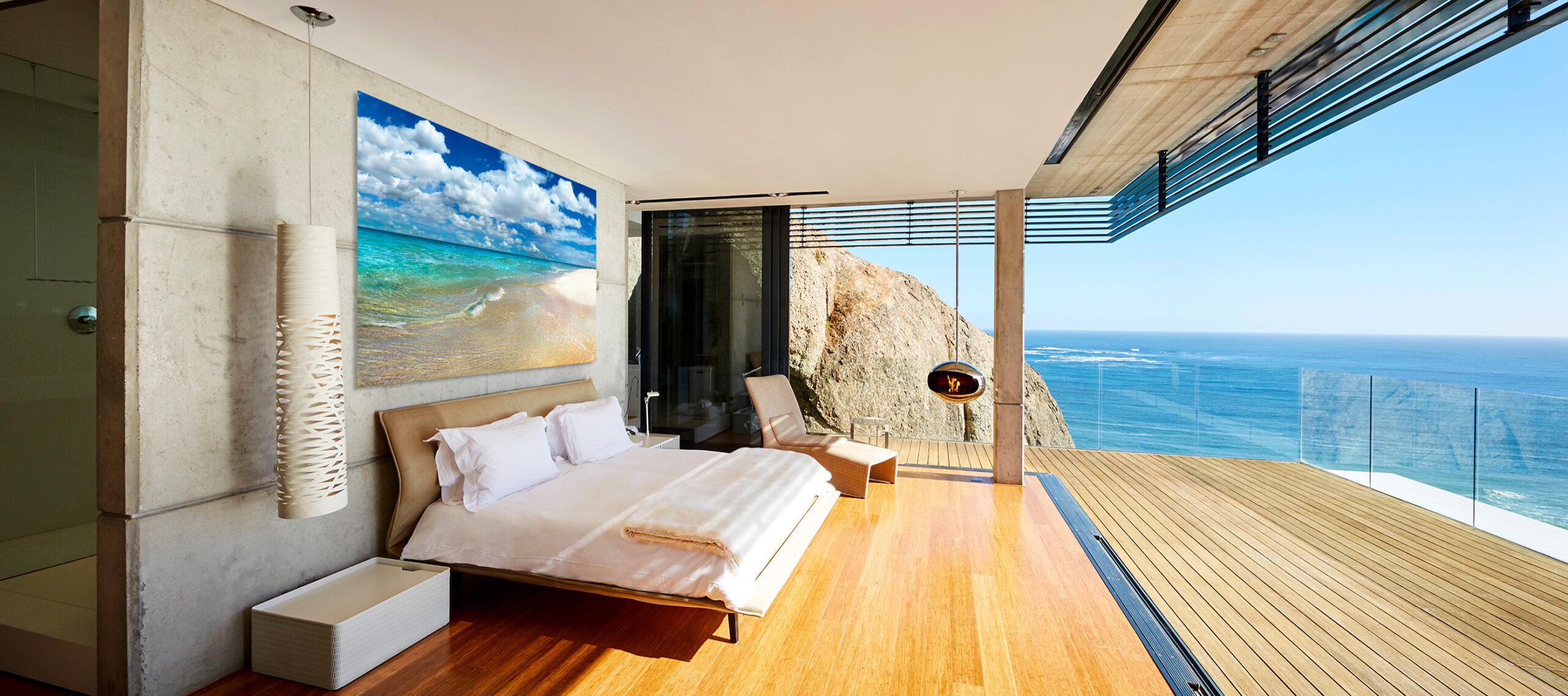 Modern,Luxury,Bedroom,Open,To,Patio,With,Sunny,Ocean,View