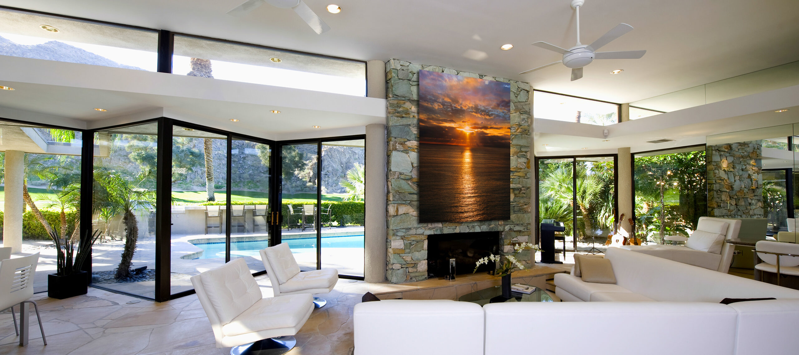 Sunken,Seating,Area,And,Exposed,Stone,Fireplace,In,Spacious,Living
